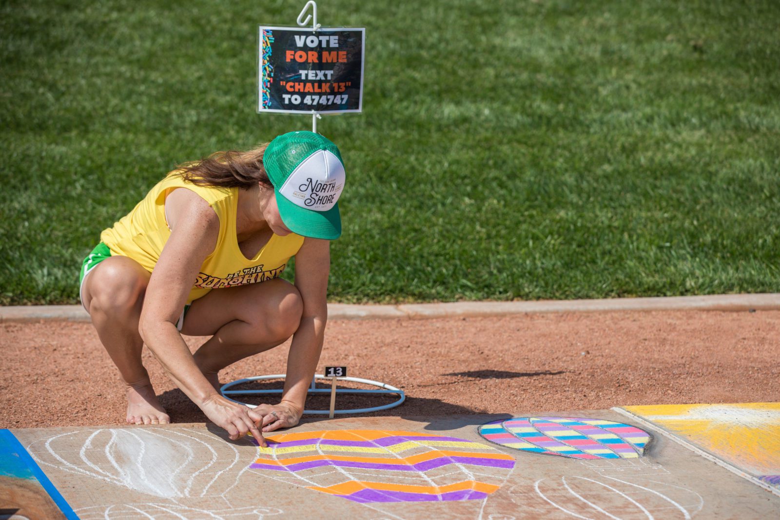 woman drawing chalk art